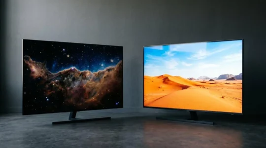 Two premium television screens side by side in a minimalist setting showcasing display technology contrast